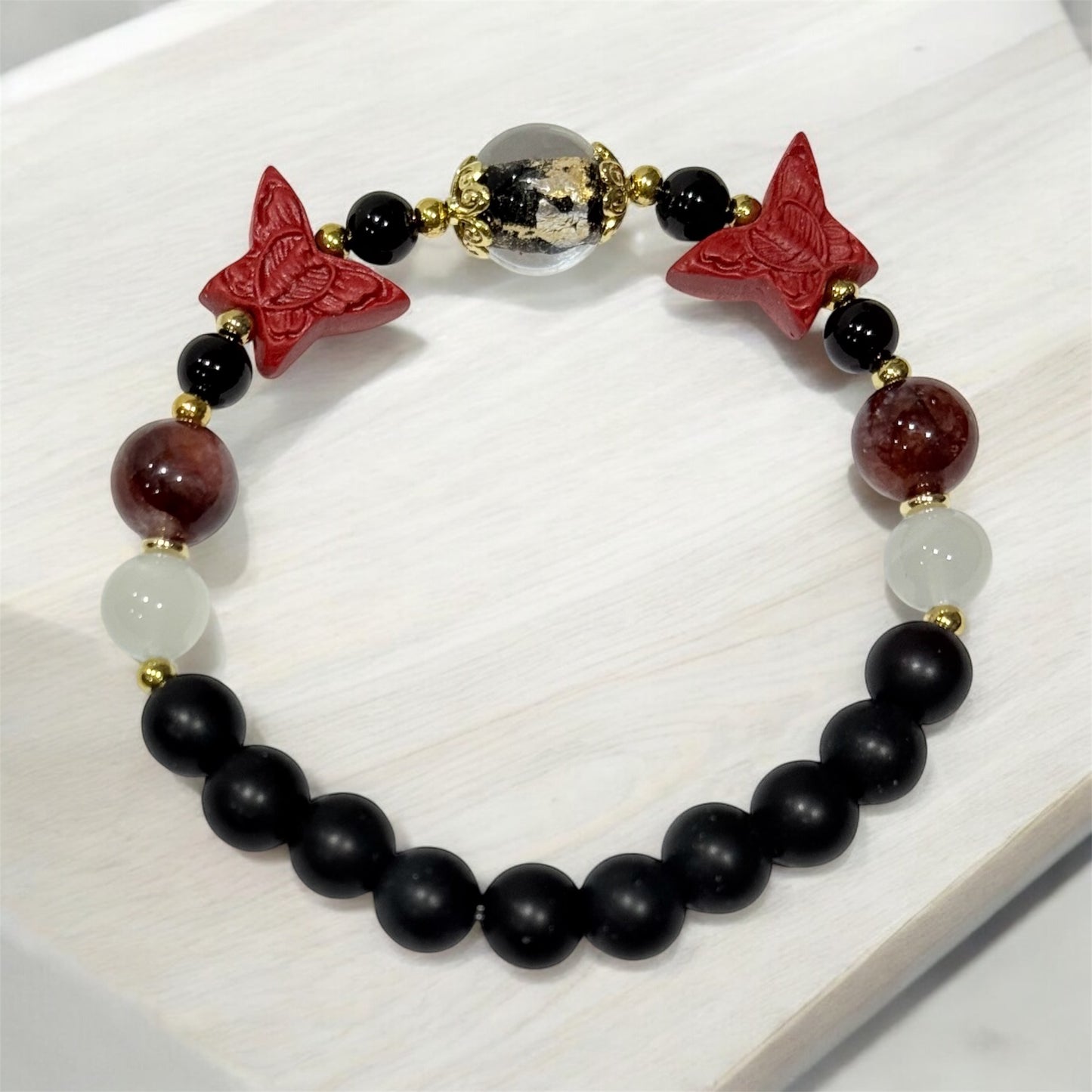 10 of 100 Bracelet with Moonstone, Fire quartz, Cinnabar, Onix and agate