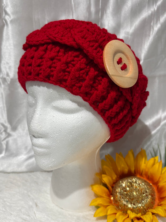 D002. Diadema tejida a mano con boton de madera.